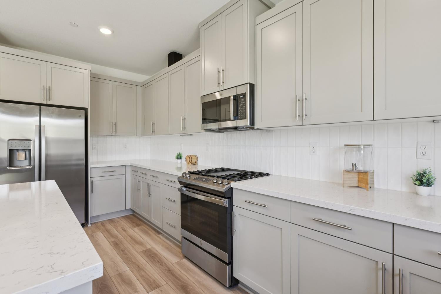 3946 Needham Street Tracy, CA 95377 - Photo 10 of 40 a kitchen with cabinets stainless steel appliances and sink