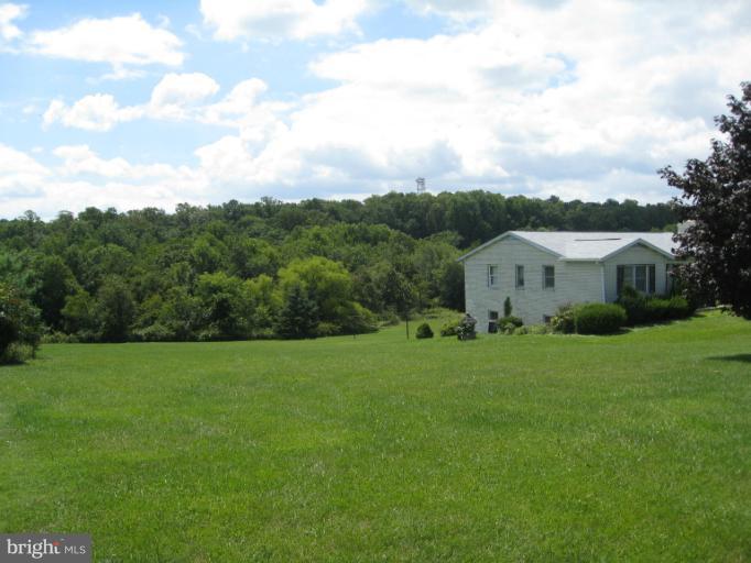 4599 Griffith Road Mount Airy, MD 21771 - Photo 7 of 11 a view of a house with backyard and garden