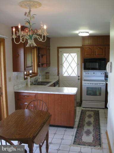 4599 Griffith Road Mount Airy, MD 21771 - Photo 9 of 11 a view of a dining room with furniture and window