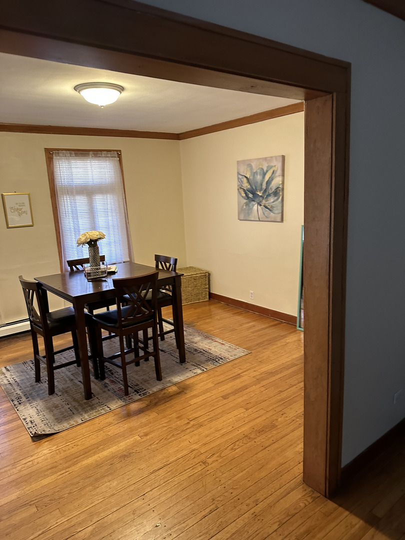 309 Ridgeland Avenue Elmhurst, IL 60126 - Photo 3 of 8 a view of a dining room with furniture and window