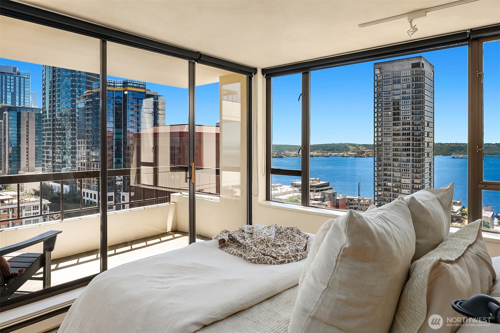 2201 3rd Avenue, Unit 2003 Seattle, WA 98121 - Photo 1 of 38 a bedroom with furniture and a floor to ceiling window