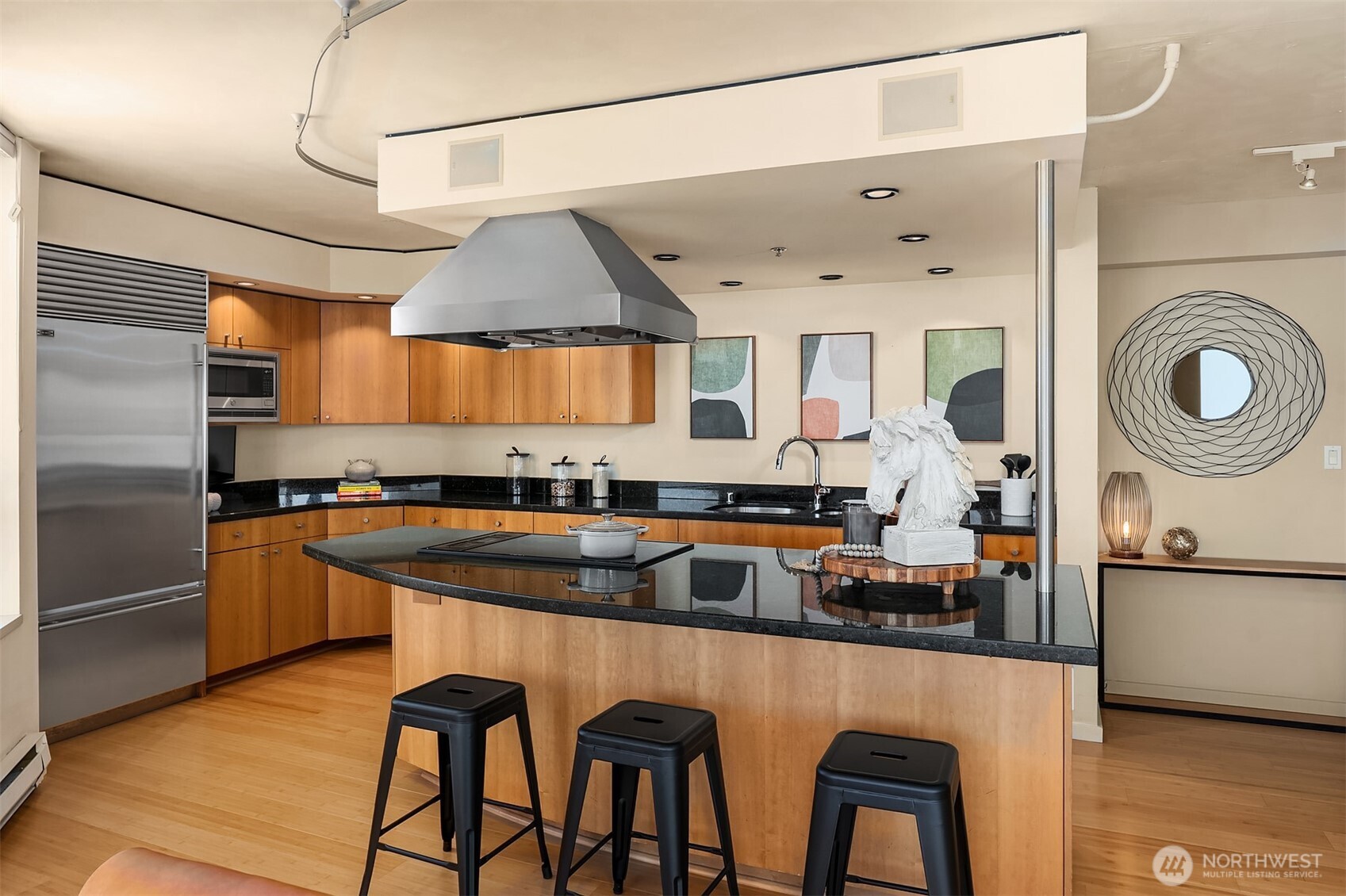 2201 3rd Avenue, Unit 2003 Seattle, WA 98121 - Photo 15 of 38 a kitchen with stainless steel appliances granite countertop a sink and a refrigerator