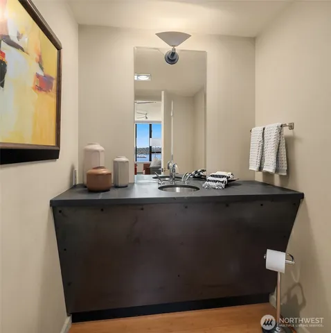 a kitchen with a sink a counter top space and cabinets