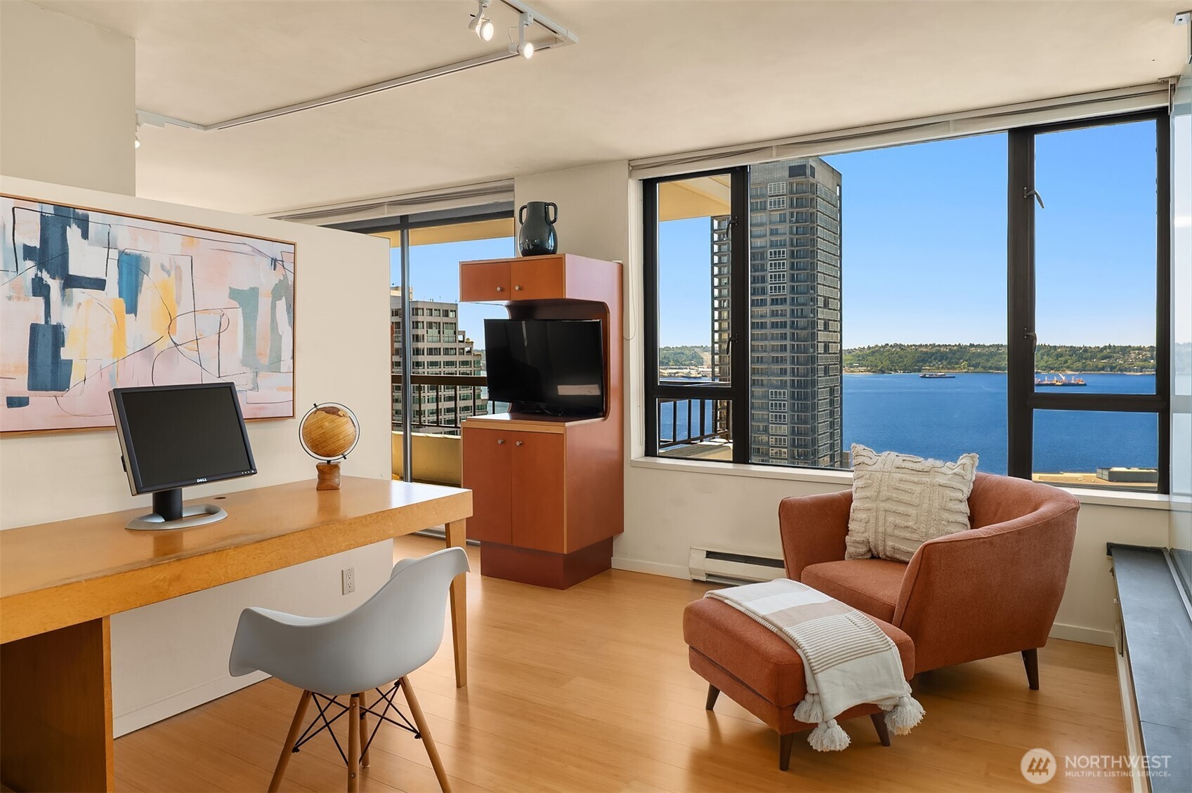 2201 3rd Avenue, Unit 2003 Seattle, WA 98121 - Photo 20 of 38 a living room with furniture a flat screen tv and large windows