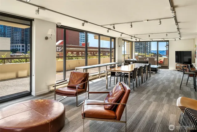 a kitchen with a wooden floor and white cabinets