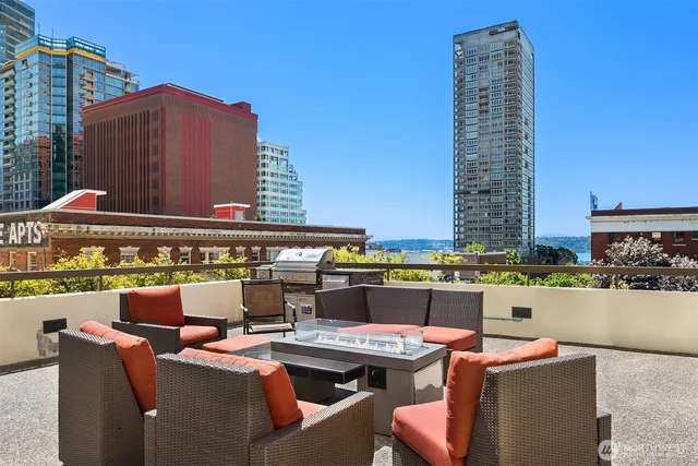 a view of swimming pool with outdoor seating