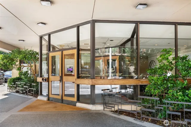 a front view of a building with a yard