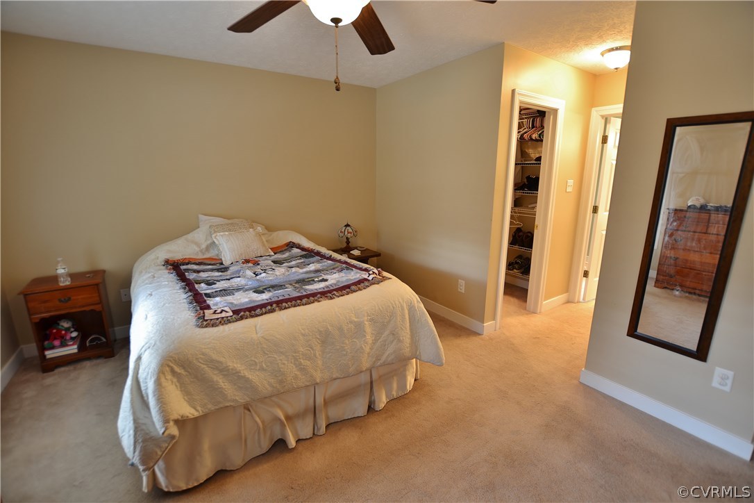 81 Loomis Road Aylett, VA 23009 - Photo 15 of 23 a bedroom with a bed and a mirror