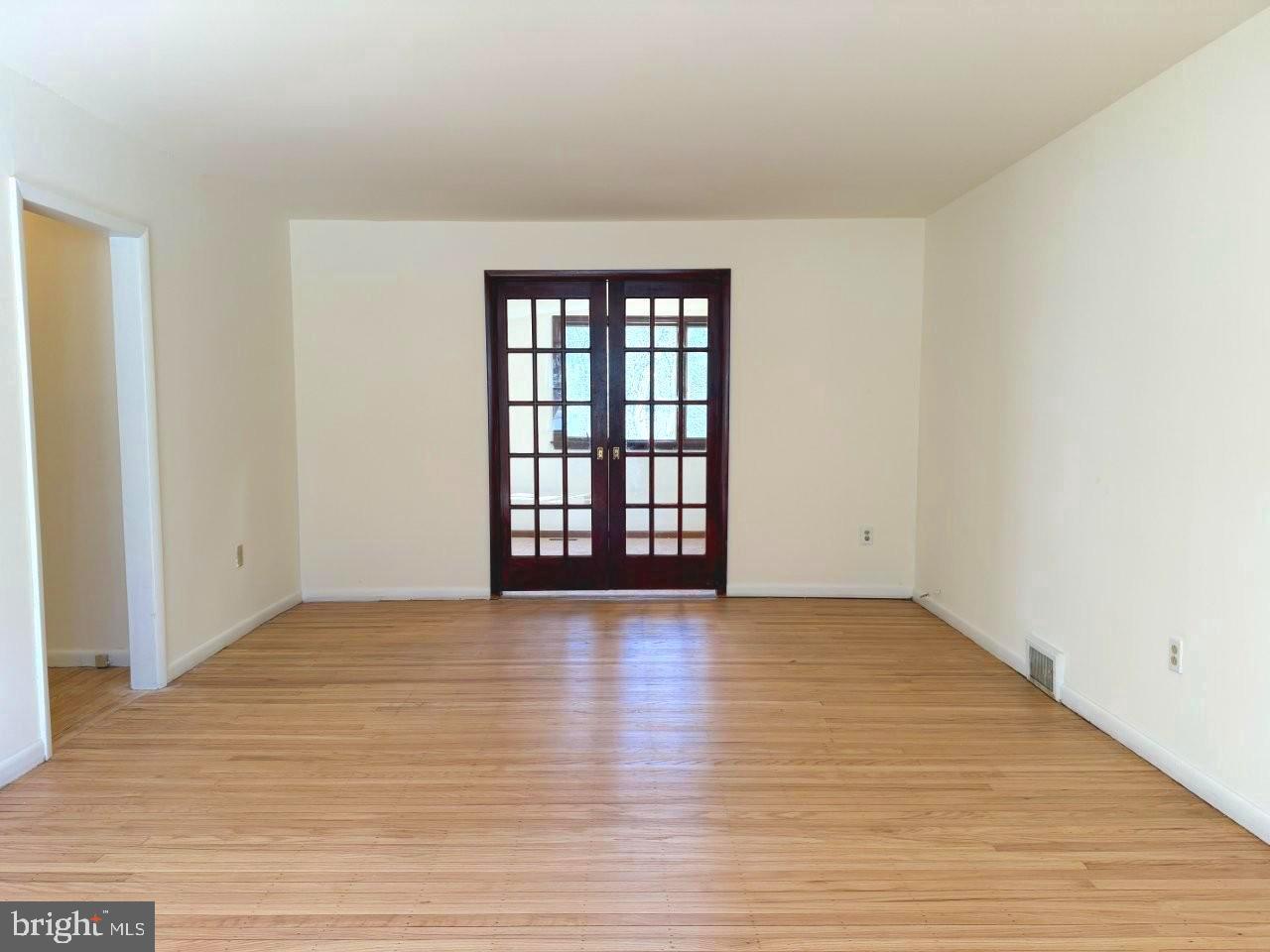 637 North Bishop Avenue Springfield, PA 19064 - Photo 17 of 51 a view of an empty room with window and wooden floor