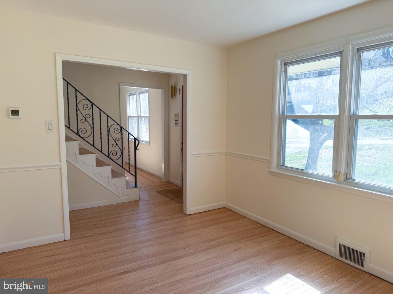 637 North Bishop Avenue Springfield, PA 19064 - Photo 22 of 51 a view of an entryway with wooden floor and door
