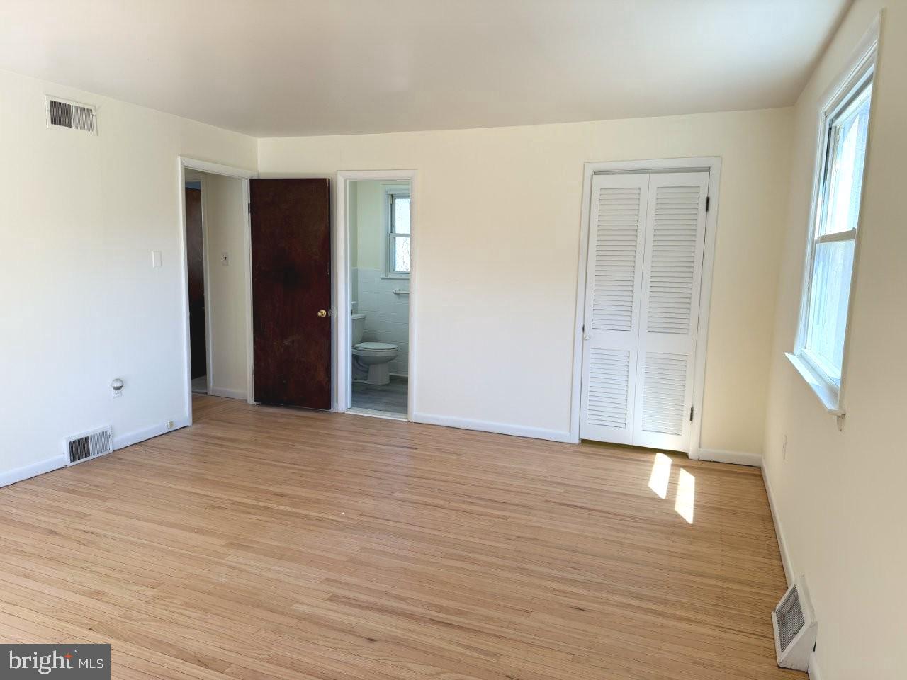 637 North Bishop Avenue Springfield, PA 19064 - Photo 25 of 51 a view of an empty room with wooden floor and a window