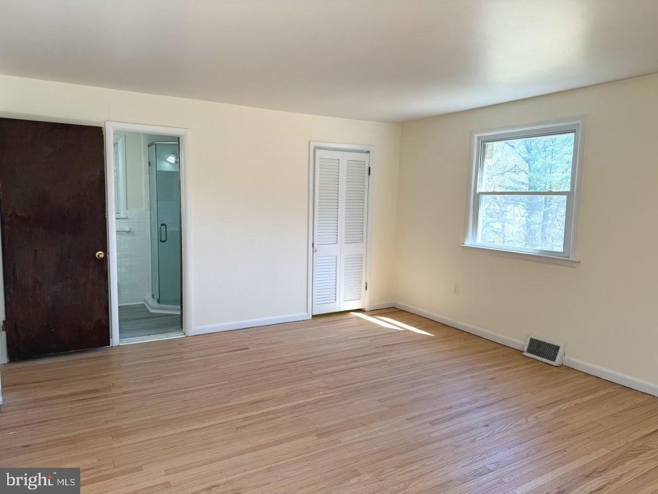 637 North Bishop Avenue Springfield, PA 19064 - Photo 26 of 51 a view of an empty room with wooden floor and a window