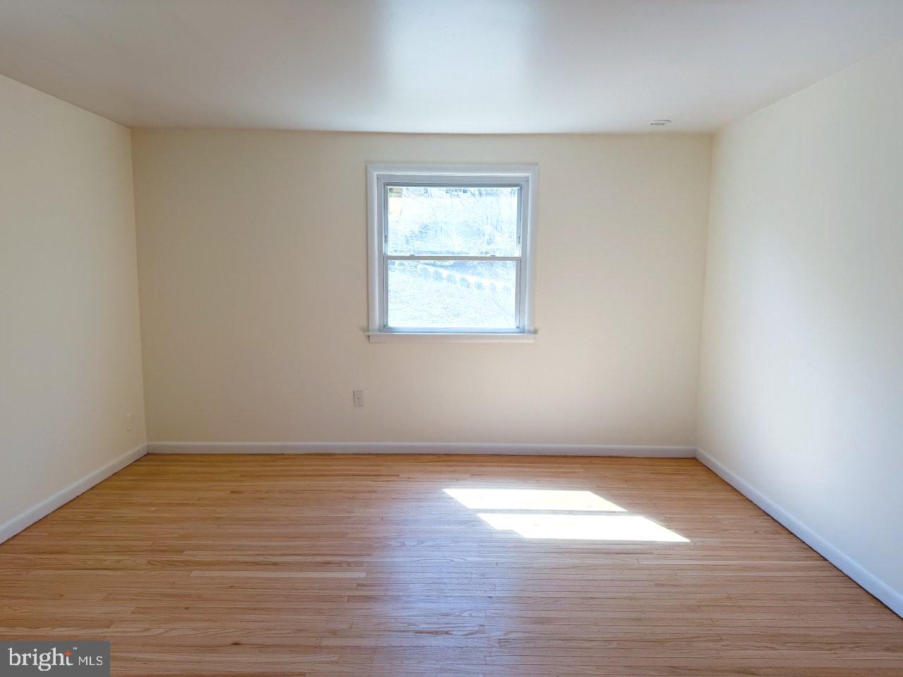637 North Bishop Avenue Springfield, PA 19064 - Photo 27 of 51 an empty room with wooden floor and windows