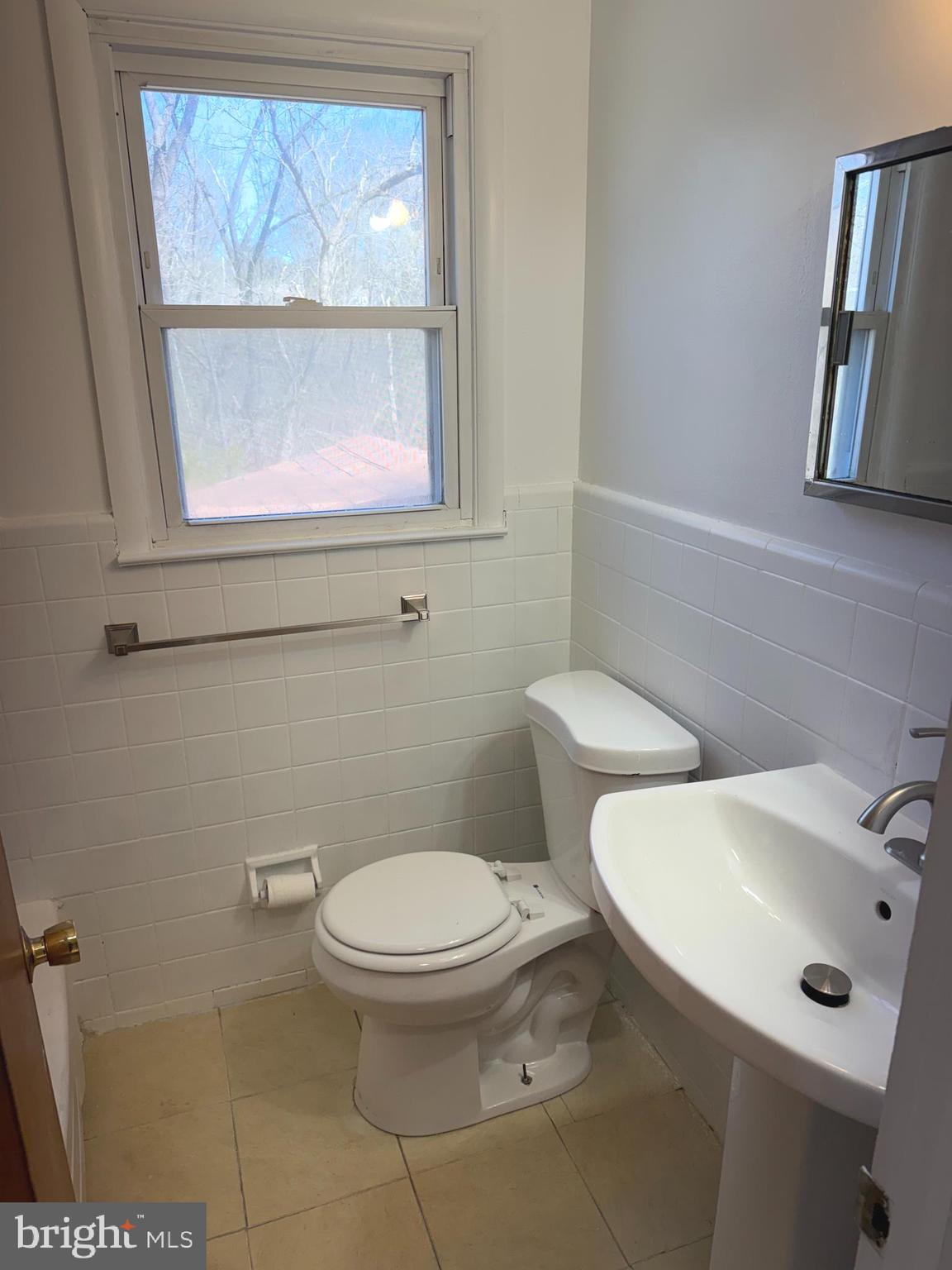 637 North Bishop Avenue Springfield, PA 19064 - Photo 30 of 51 a white toilet sitting next to a bathroom sink