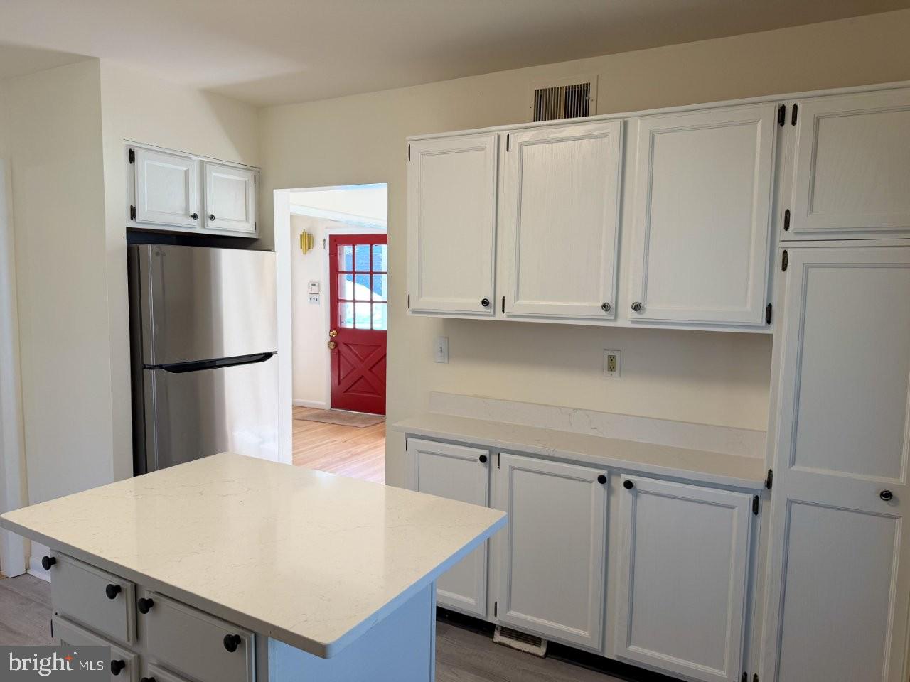 637 North Bishop Avenue Springfield, PA 19064 - Photo 8 of 51 a kitchen with a refrigerator a stove and white cabinets