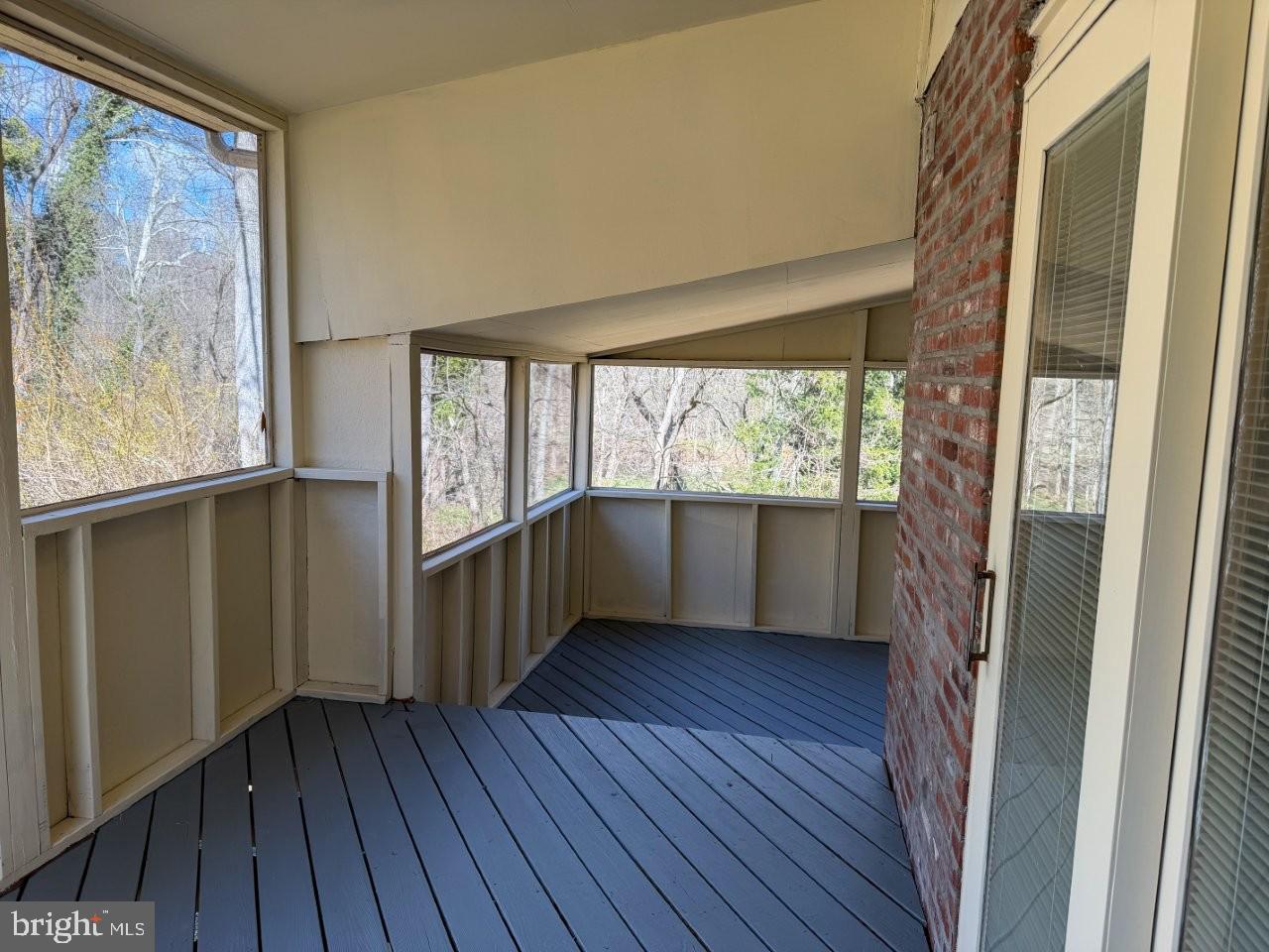 637 North Bishop Avenue Springfield, PA 19064 - Photo 10 of 51 a view of an empty room with wooden floor and a window