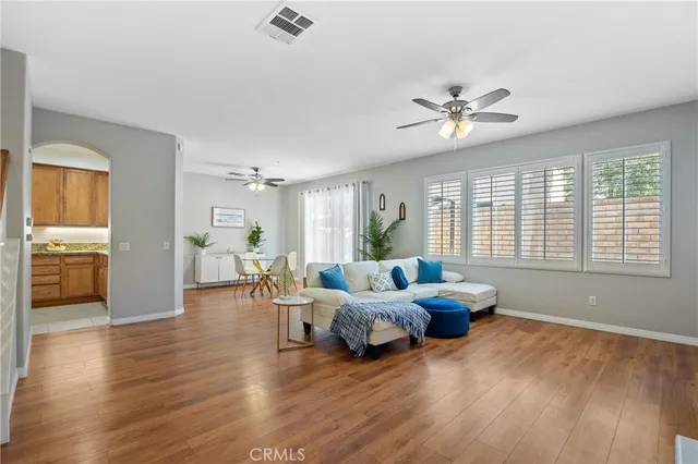a bedroom with furniture and wooden floor