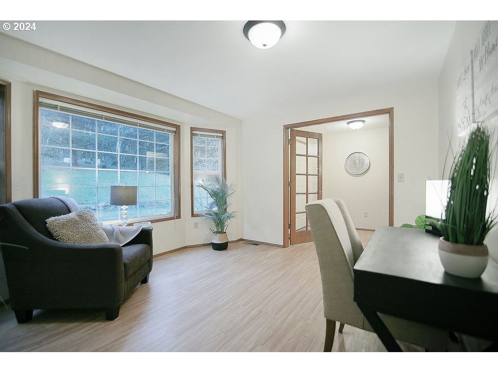 59 Whitewater Road Longview, WA 98632 - Photo 16 of 39 a dining room with a wooden table and chairs