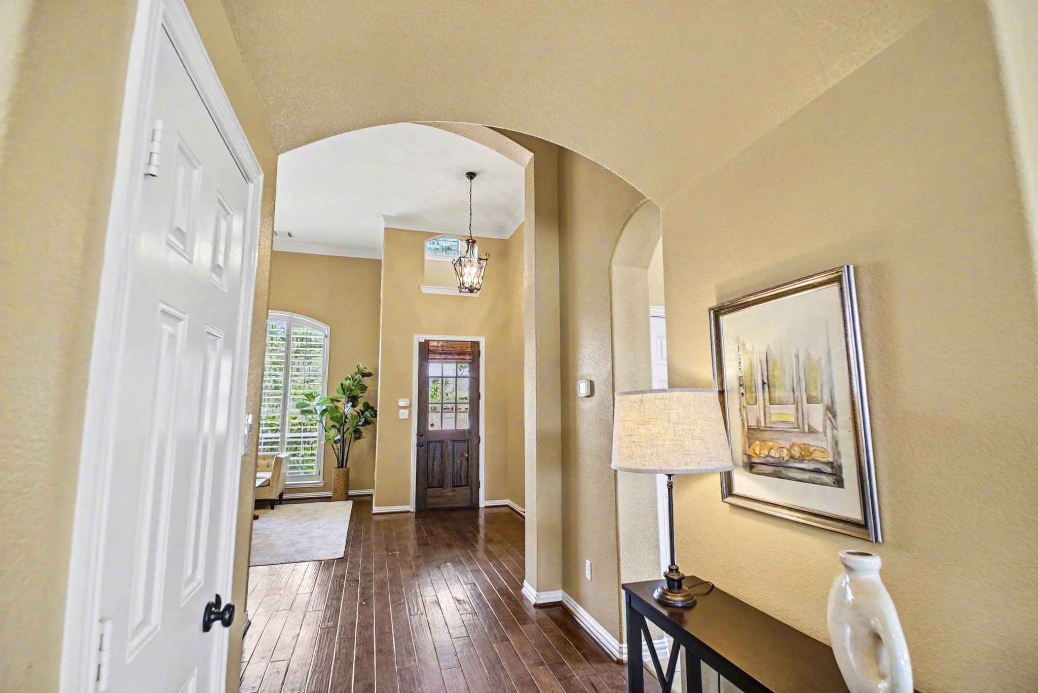 8210 Thunder Ridge Way Missouri City, TX 77459 - Photo 8 of 42 Experience elegant design with repeating architectural arches framing the doorways and windows, leading to the inviting front entrance.