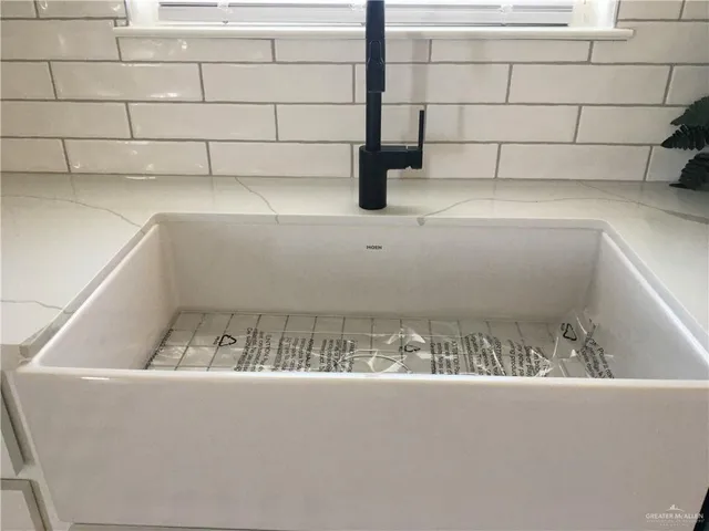 a stove top oven sitting inside of a kitchen