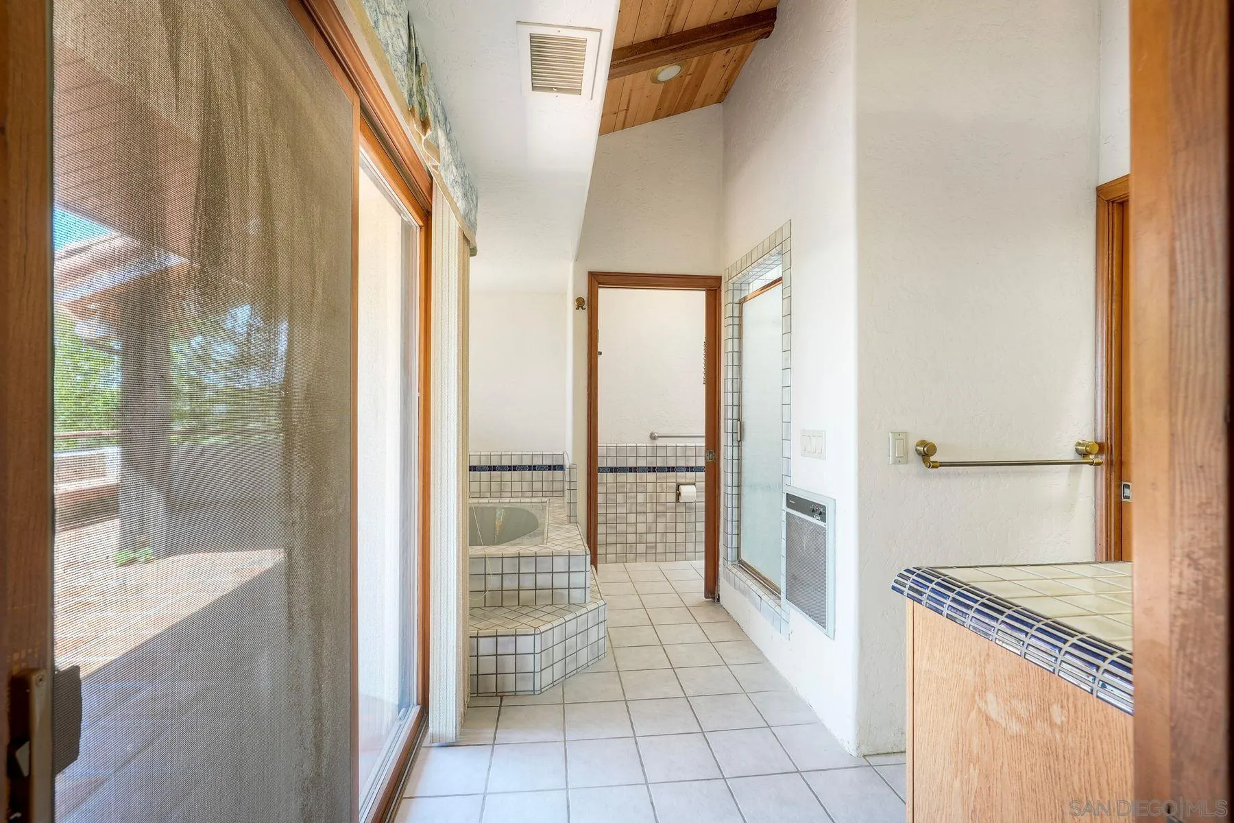 30458 Cool Valley Highlands Road Valley Center, CA 92082 - Photo 36 of 47 a bathroom with a tub shower and sink