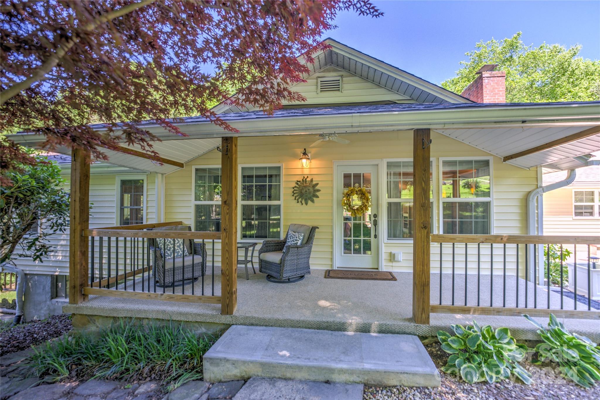 a view of a patio with table and chairs and potted plants