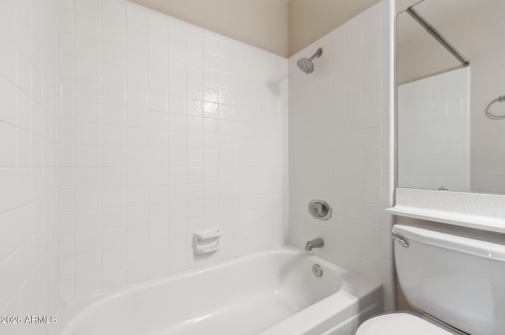 170 East Guadalupe Road, Unit 112 Gilbert, AZ 85234 - Photo 22 of 22 a bathroom with a toilet and a bathtub