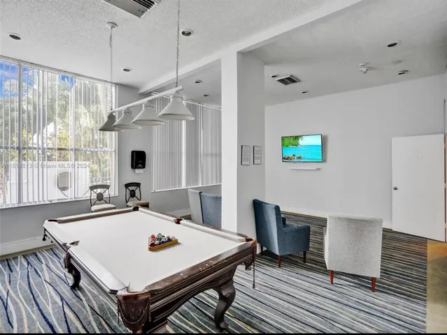 a view of a livingroom with furniture and window