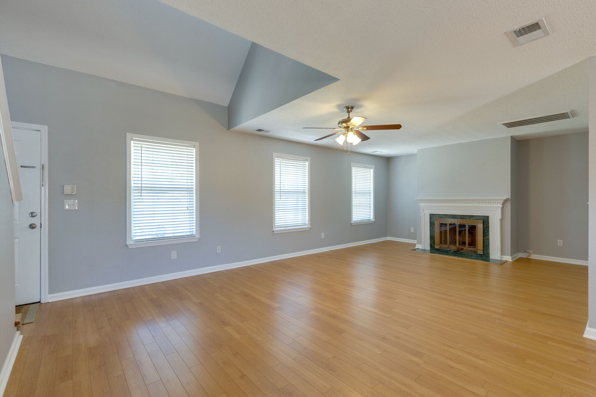 2106 Spring Hill Circle Spring Hill, TN 37174 - Photo 5 of 38 a view of an empty room with window and fireplace