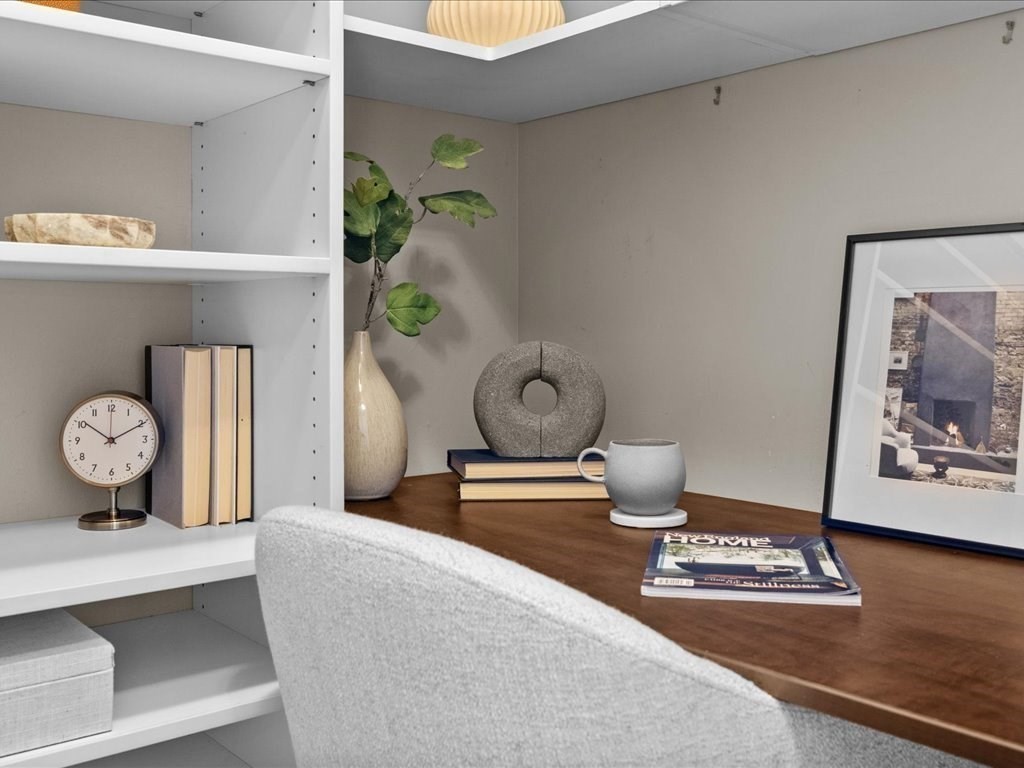 65 East India Row, Unit 33A Boston, MA 02110 - Photo 13 of 36 a bedroom with bed and wooden floor