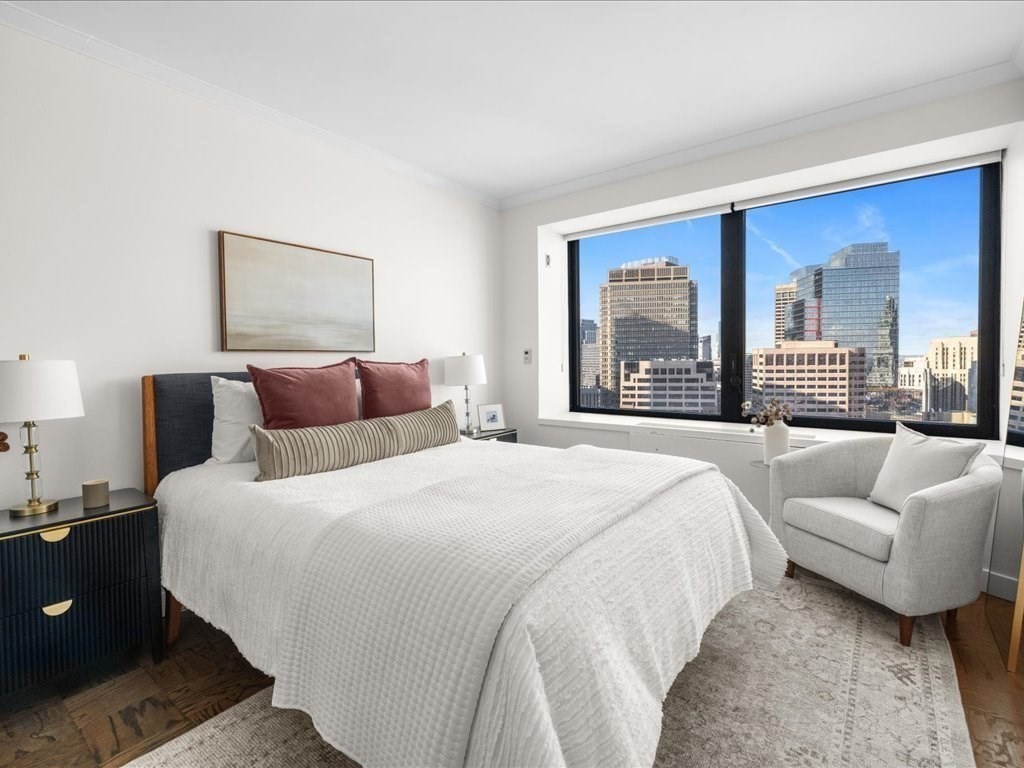 65 East India Row, Unit 33A Boston, MA 02110 - Photo 23 of 36 a bedroom with bed and a large window