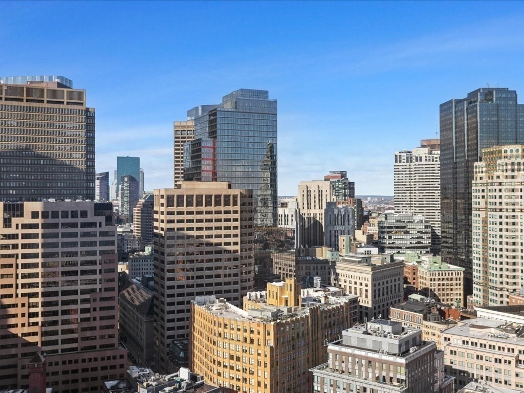 65 East India Row, Unit 33A Boston, MA 02110 - Photo 24 of 36 a city view with tall buildings