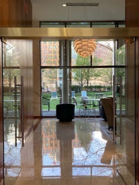 65 East India Row, Unit 33A Boston, MA 02110 - Photo 29 of 36 a living room with fireplace furniture and a floor to ceiling window