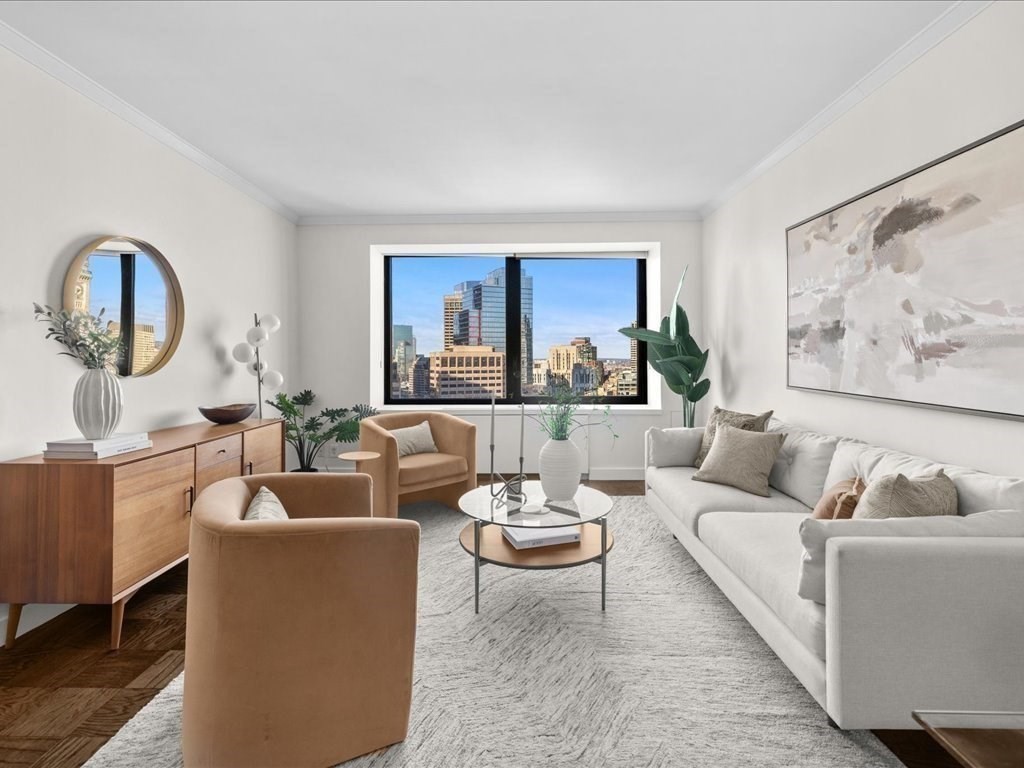 65 East India Row, Unit 33A Boston, MA 02110 - Photo 4 of 36 a living room with furniture and a large window