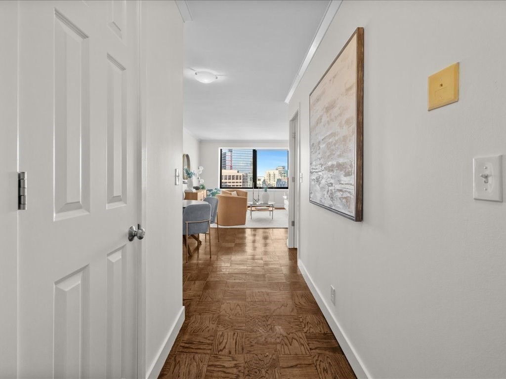 65 East India Row, Unit 33A Boston, MA 02110 - Photo 10 of 36 a hallway with a view of kitchen and living room