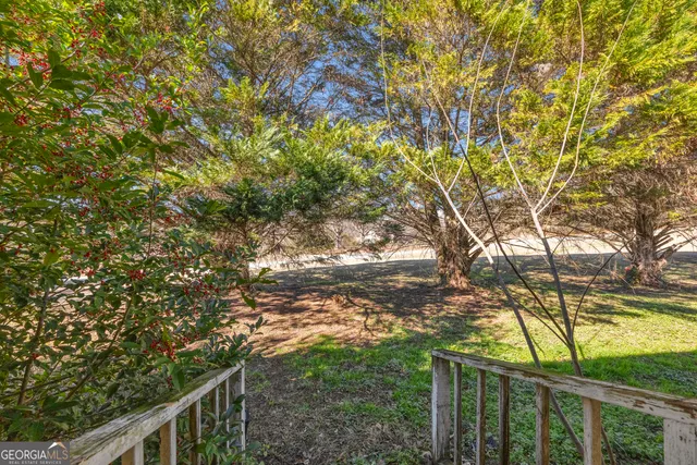 a view of a room with large windows
