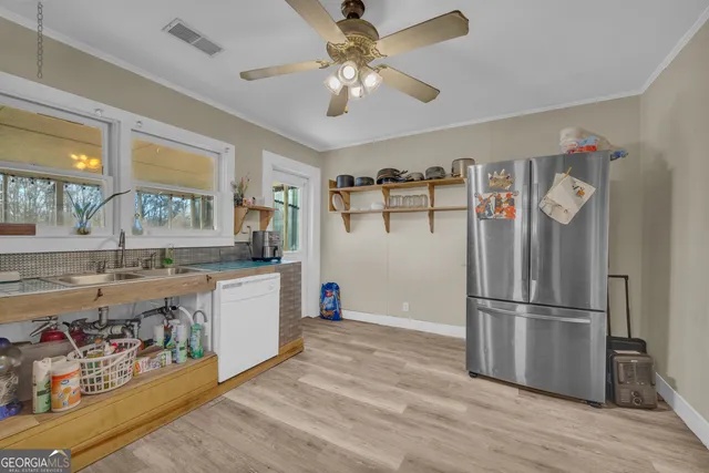 a spacious bedroom with a bed and window