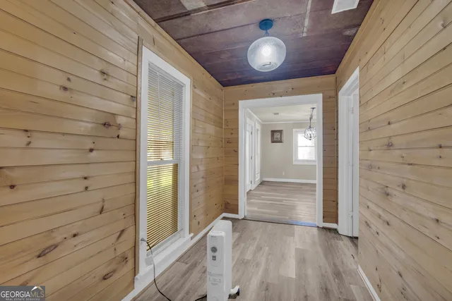 a bathroom with a sink a mirror and a window