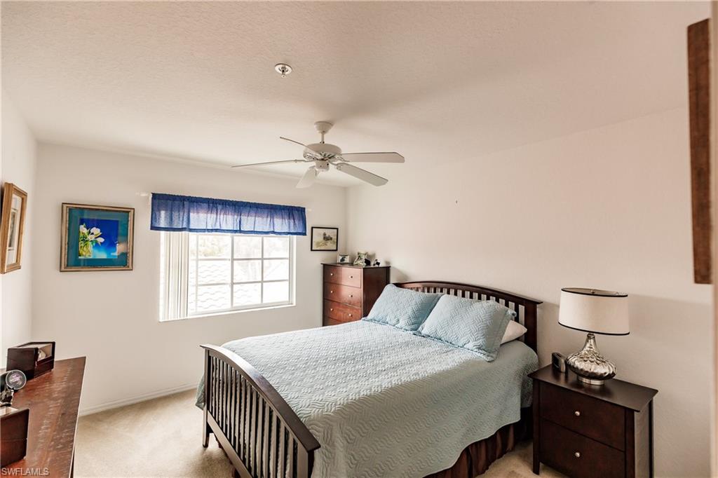 320 Gabriel Circle, Unit 3608 Naples, FL 34104 - Photo 13 of 32 a bedroom with a bed and window