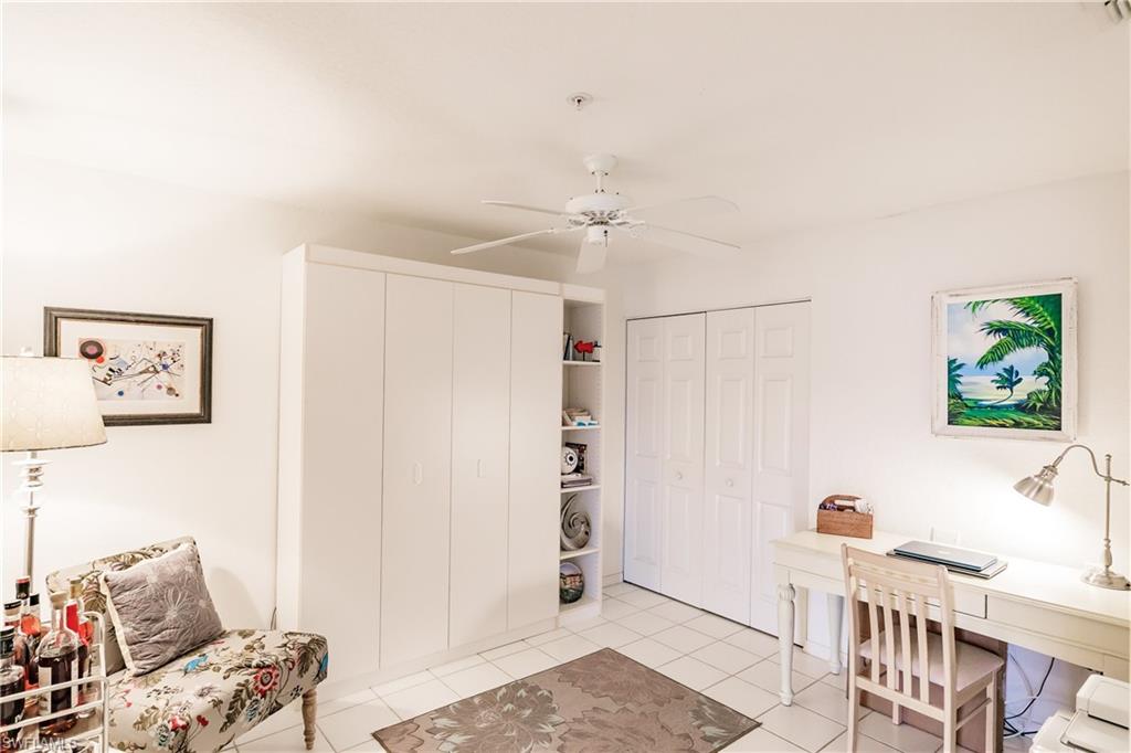 320 Gabriel Circle, Unit 3608 Naples, FL 34104 - Photo 15 of 32 a bedroom with furniture and a window