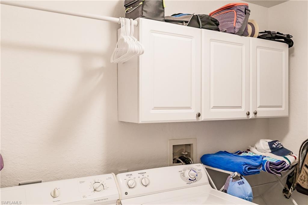 320 Gabriel Circle, Unit 3608 Naples, FL 34104 - Photo 17 of 32 a utility room with dryer and washer