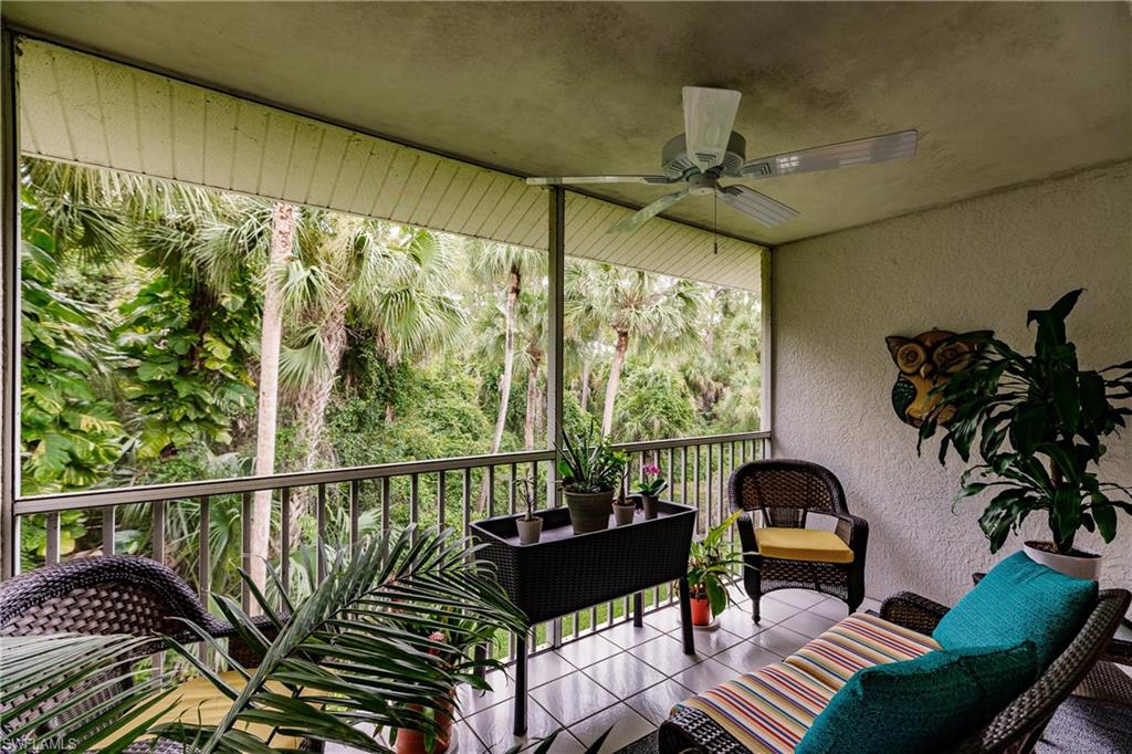 320 Gabriel Circle, Unit 3608 Naples, FL 34104 - Photo 18 of 32 a living room with furniture and a large window