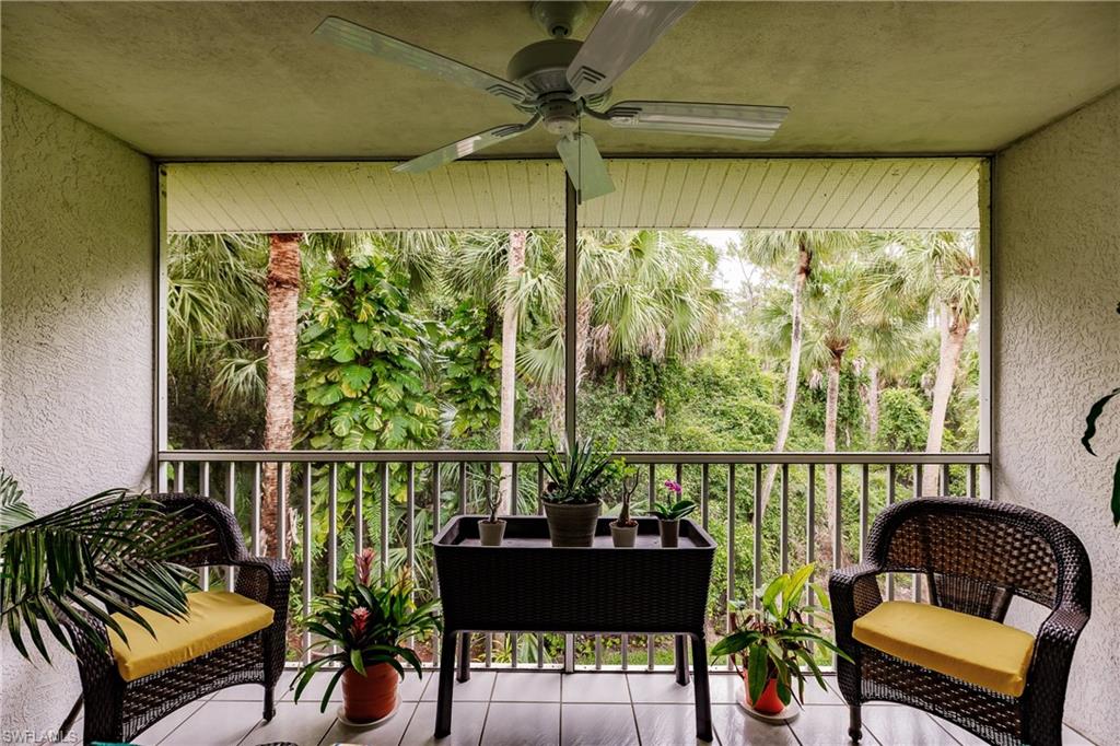 320 Gabriel Circle, Unit 3608 Naples, FL 34104 - Photo 20 of 32 a living room with furniture and a window