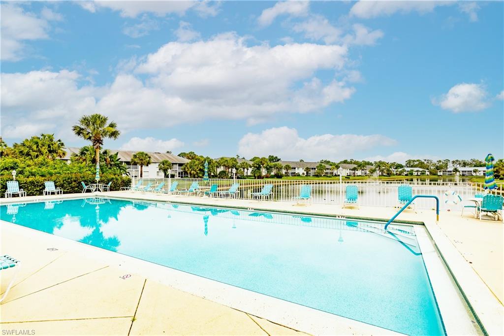 320 Gabriel Circle, Unit 3608 Naples, FL 34104 - Photo 25 of 32 a view of a lake with a terrace
