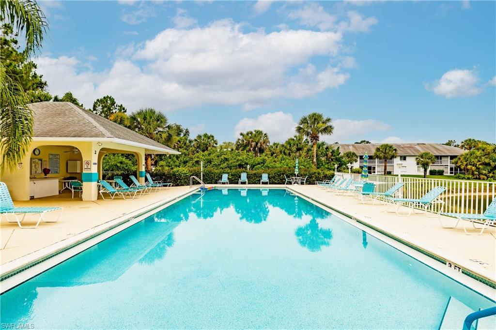 320 Gabriel Circle, Unit 3608 Naples, FL 34104 - Photo 26 of 32 a view of swimming pool with a garden