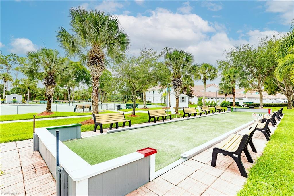 320 Gabriel Circle, Unit 3608 Naples, FL 34104 - Photo 27 of 32 an outdoor space with swimming pool and furniture