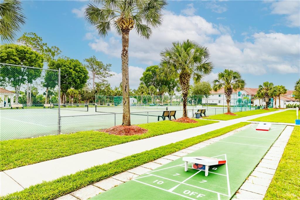 320 Gabriel Circle, Unit 3608 Naples, FL 34104 - Photo 28 of 32 a view of swimming pool with a yard