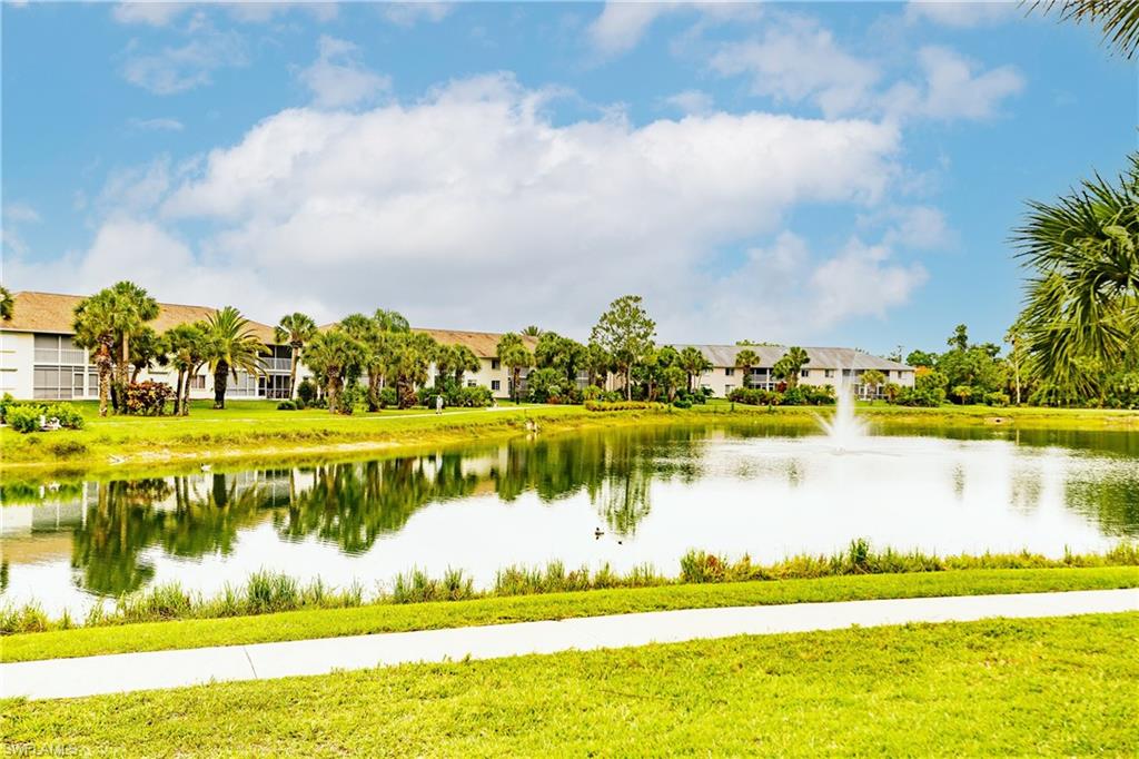 320 Gabriel Circle, Unit 3608 Naples, FL 34104 - Photo 32 of 32 a view of a lake with a big yard