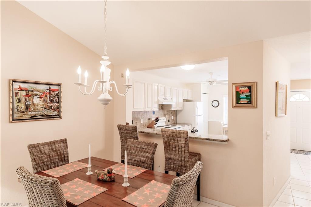 320 Gabriel Circle, Unit 3608 Naples, FL 34104 - Photo 8 of 32 a workspace with furniture and window