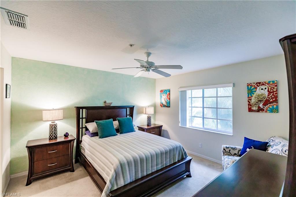 320 Gabriel Circle, Unit 3608 Naples, FL 34104 - Photo 10 of 32 a bedroom with a bed and window